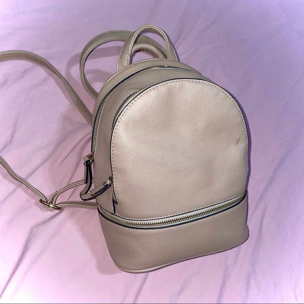 Beige mini backpack. Mini bag